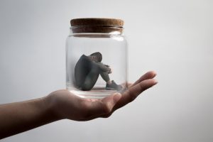 City of London Counselling - man in a jar sitting on a hand