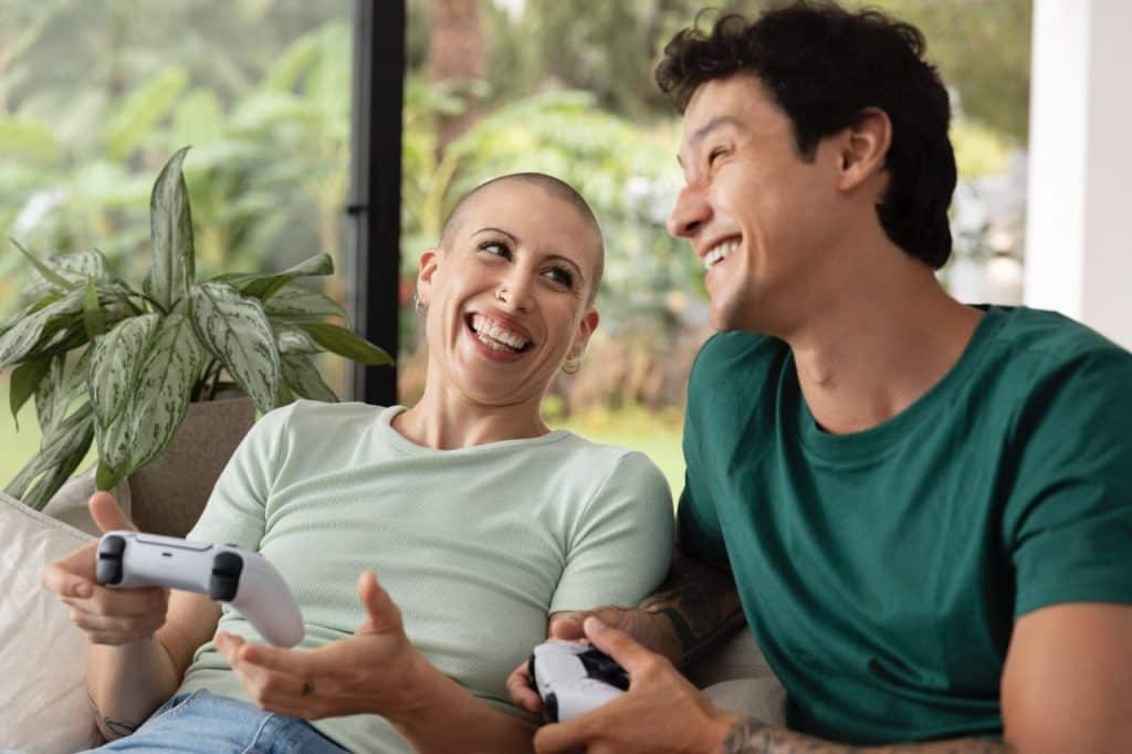 couple having fun while playing videogames. Image by Freepik.