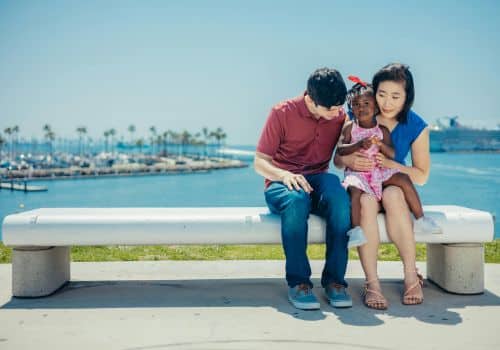 Multi cultural family by the beach