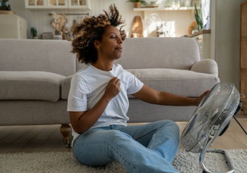 Menopausal woman experiencing hot flashes 